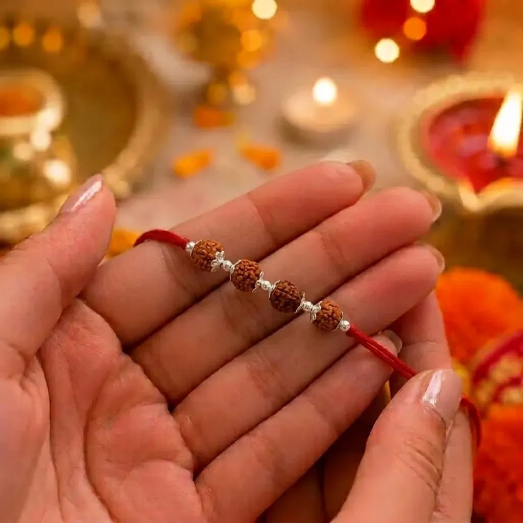 Marvel Silver 4 Rudraksha Rakhi featuring four sacred Rudraksha beads, premium silver spacers, and a traditional red thread for Raksha Bandhan celebrations.
