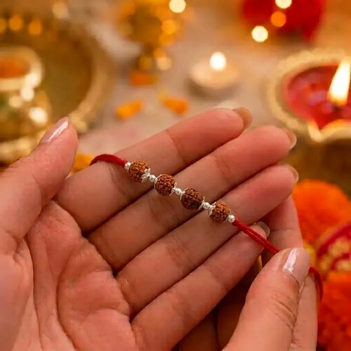 Marvel Silver 4 Rudraksha Rakhi featuring four sacred Rudraksha beads, premium silver spacers, and a traditional red thread for Raksha Bandhan celebrations.