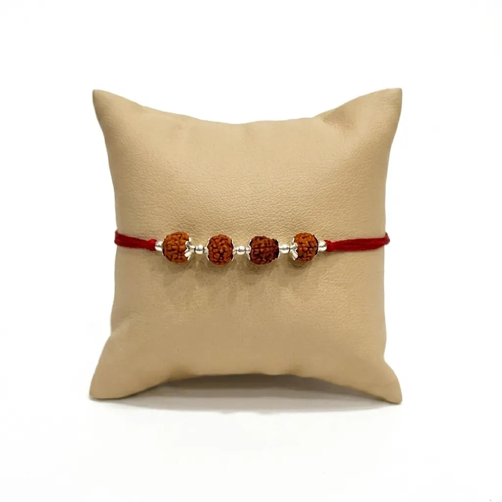 Marvel Silver 4 Rudraksha Rakhi featuring four sacred Rudraksha beads, premium silver spacers, and a traditional red thread for Raksha Bandhan celebrations.