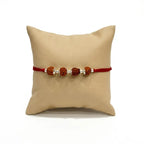 Marvel Silver 4 Rudraksha Rakhi featuring four sacred Rudraksha beads, premium silver spacers, and a traditional red thread for Raksha Bandhan celebrations.