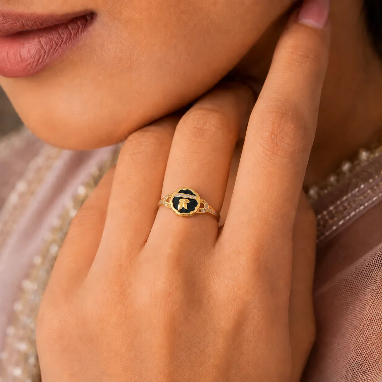 9K gold black floral crystal ring for girls with white stone detailing and polished gold leaf design by Marvel Silver.