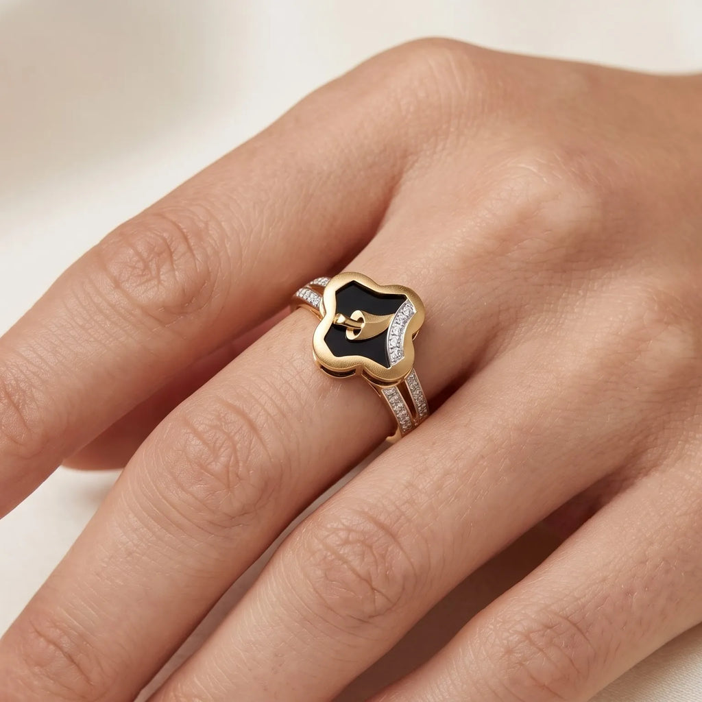 9K gold black floral crystal ring for girls with gold leaf motif, white stone detailing and polished gold band by Marvel Silver.