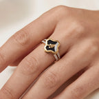 9K gold black floral crystal ring for girls with gold leaf motif, white stone detailing and polished gold band by Marvel Silver.