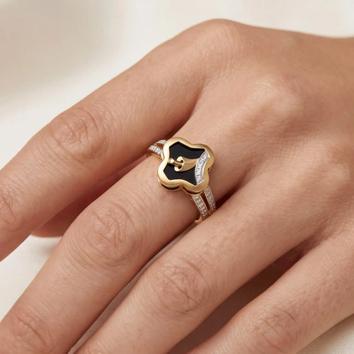 9K gold black floral crystal ring for girls with gold leaf motif, white stone detailing and polished gold band by Marvel Silver.