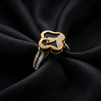 9K gold black floral crystal ring for girls with gold leaf motif, white stone detailing and polished gold band by Marvel Silver.