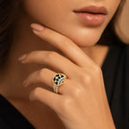 9K gold black heart crystal designer ring for girls with black enamel-style top, gold heart motifs and white stone detailing by Marvel Silver.