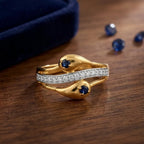 9K gold blue stone crystal ring for girls with dual blue stones, white crystal detailing and polished gold finish by Marvel Silver.
