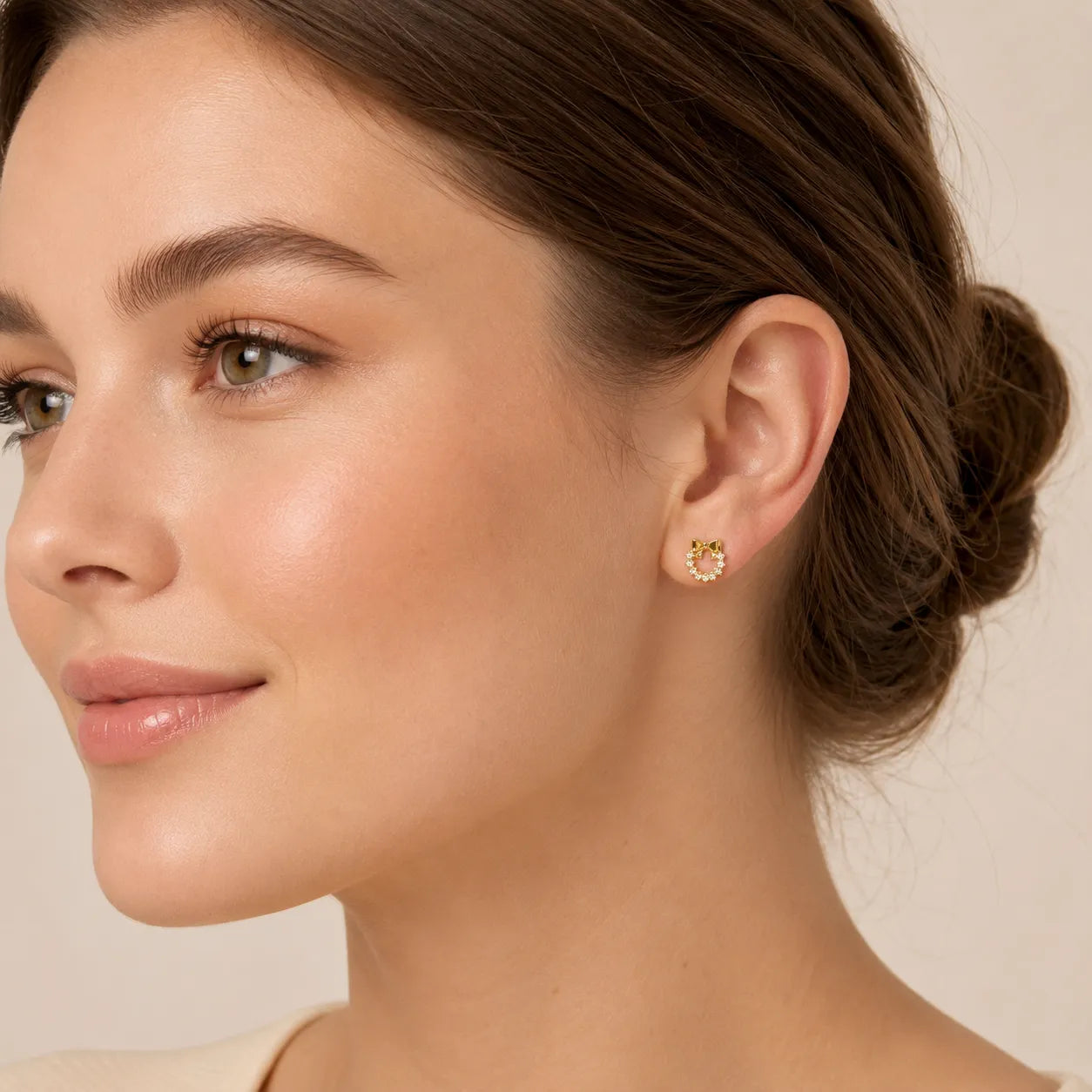 9K gold bow wreath crystal earrings for girls with sparkling white stones and polished gold finish by Marvel Silver.
