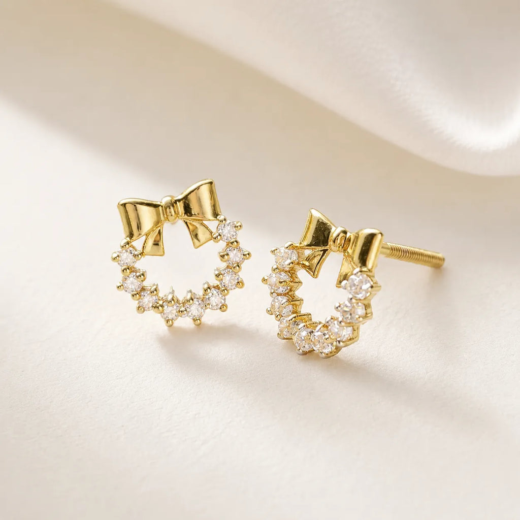 9K gold bow wreath crystal earrings for girls with sparkling white stones and polished gold finish by Marvel Silver.
