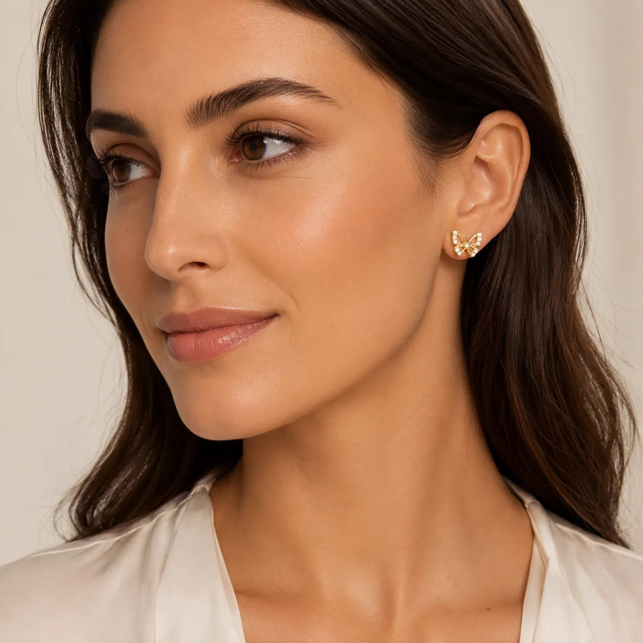 9K gold butterfly crystal earrings for girls with sparkling white stone detailing and polished gold finish by Marvel Silver.