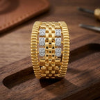 9K gold crystal basket weave ring for men with wide woven gold design, ribbed borders and white stone detailing by Marvel Silver.