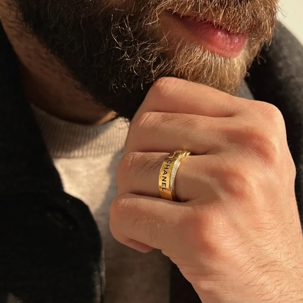 9K gold crystal chain design ring for men with a wide polished gold band and white stone detailing by Marvel Silver.
