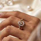 9K gold crystal eye design ring for girls with white stone detailing and polished gold finish by Marvel Silver.
