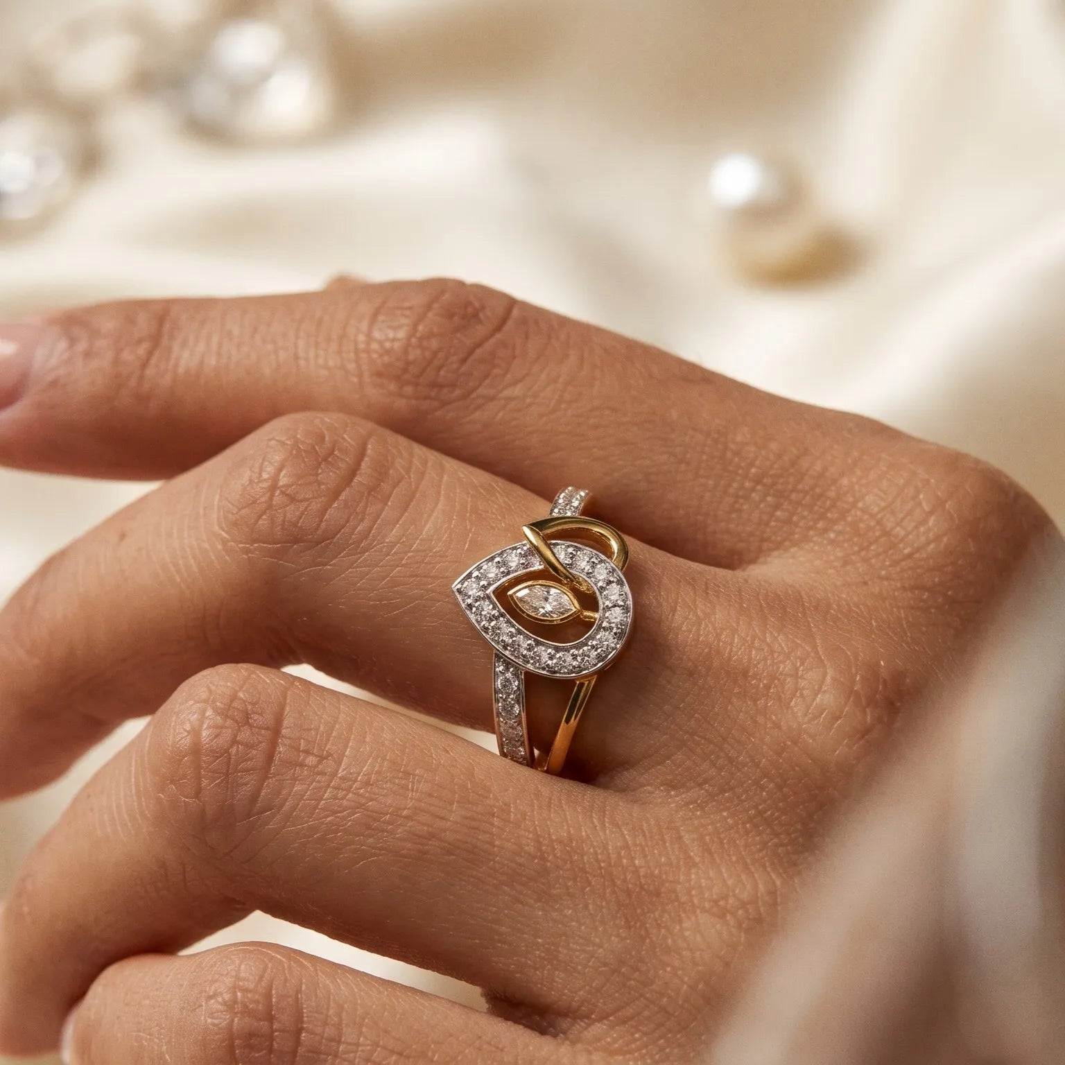 9K gold crystal eye design ring for girls with white stone detailing and polished gold finish by Marvel Silver.