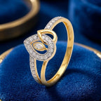 9K gold crystal eye design ring for girls with white stone detailing and polished gold finish by Marvel Silver.