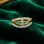 9K gold crystal oval crossover ring for girls with openwork gold bands and white stone-studded borders by Marvel Silver.