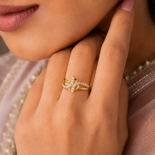 9K gold crystal swirl ring for girls with openwork crossover design and white stone detailing by Marvel Silver.