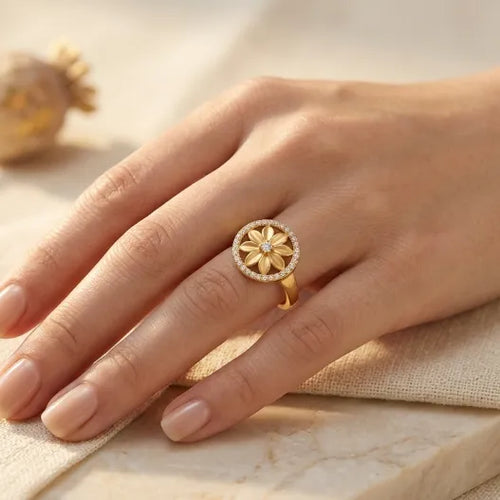 9K gold floral crystal ring for girls with round flower motif and white stone-studded border by Marvel Silver.