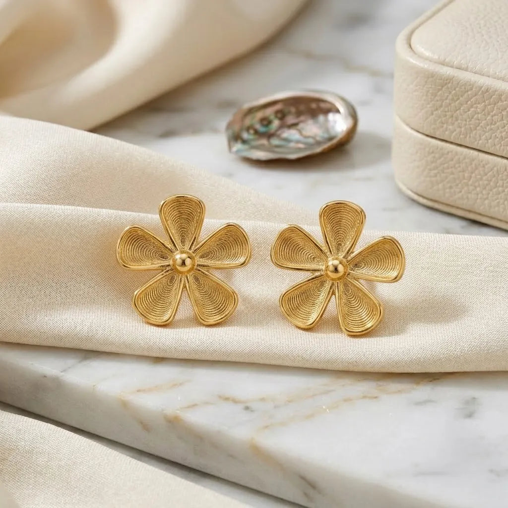 Marvel Silver 9K Gold floral stud earrings for girls featuring an elegant flower-inspired design with fine textured detailing.
