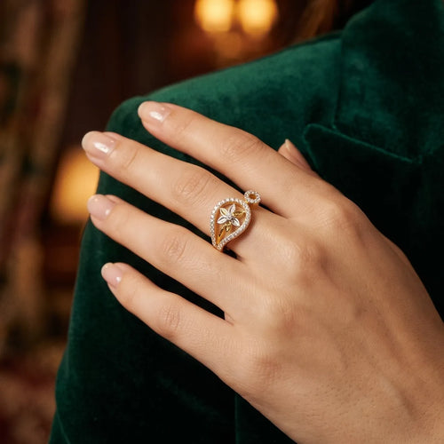 9K gold floral teardrop crystal ring for girls with white stone border and flower centre motif by Marvel Silver.