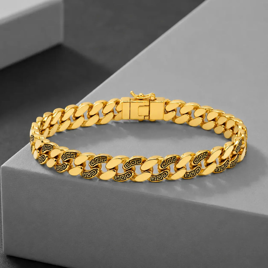 9K gold Greek pattern Cuban link bracelet for men with polished gold links, black engraved detailing and secure clasp by Marvel Silver.