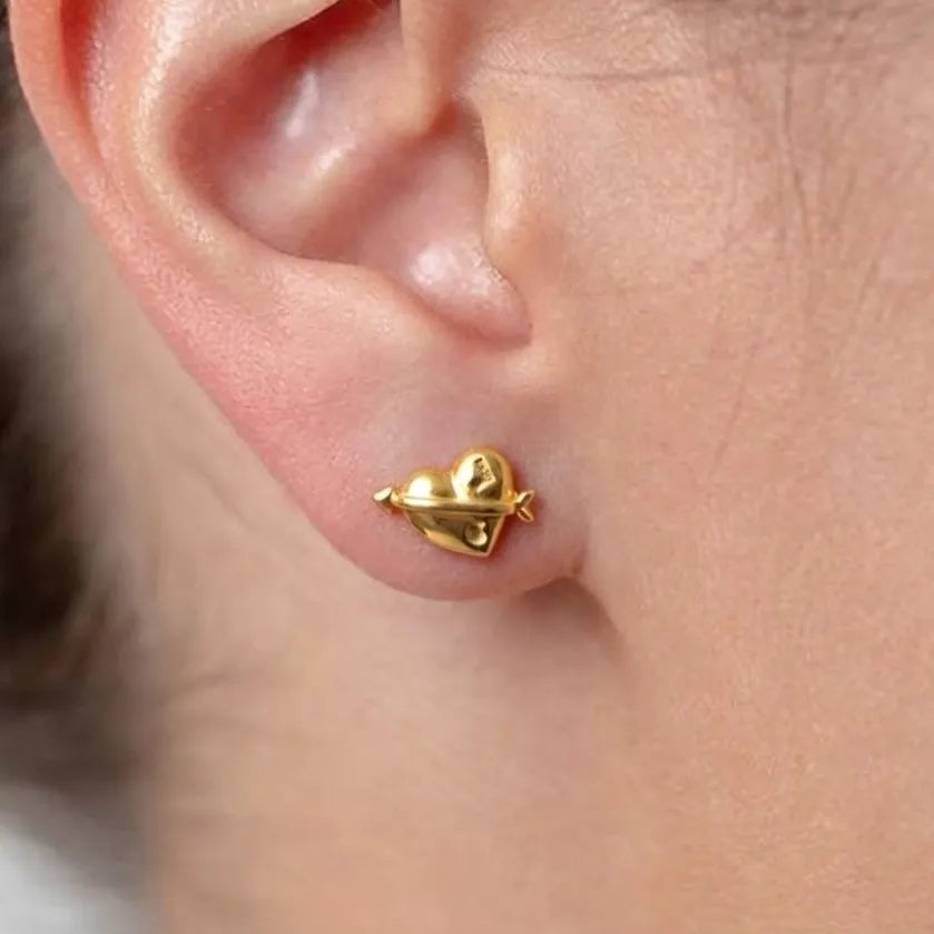 Marvel Silver 9K Gold heart and arrow stud earrings for girls featuring a polished love-inspired designer pattern with a premium gold finish.