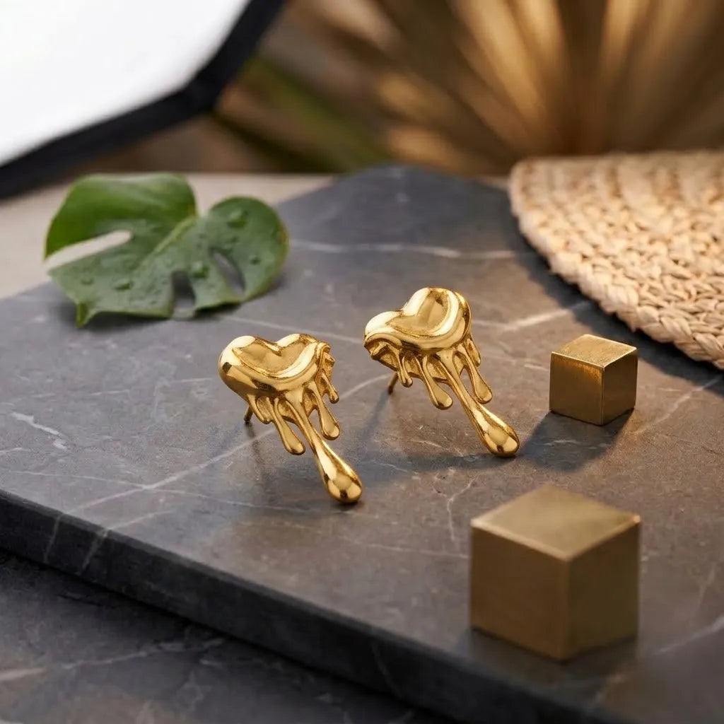 Marvel Silver 9K Gold heart drop stud earrings for girls featuring a modern heart-inspired design with an artistic dripping pattern.
