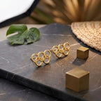 Marvel Silver 9K Gold interlocking circle stud earrings for women and girls featuring a modern geometric linked ring design.