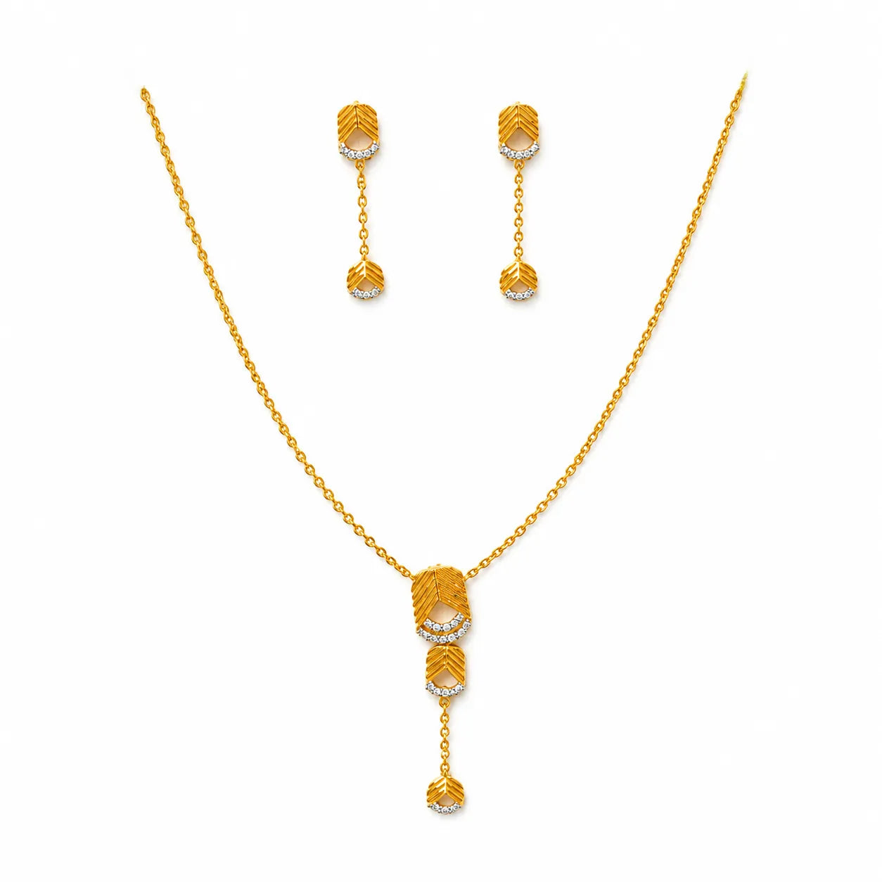 9K gold leaf drop necklace set for women with textured leaf pendant, stone detailing and matching hanging earrings by Marvel Silver.