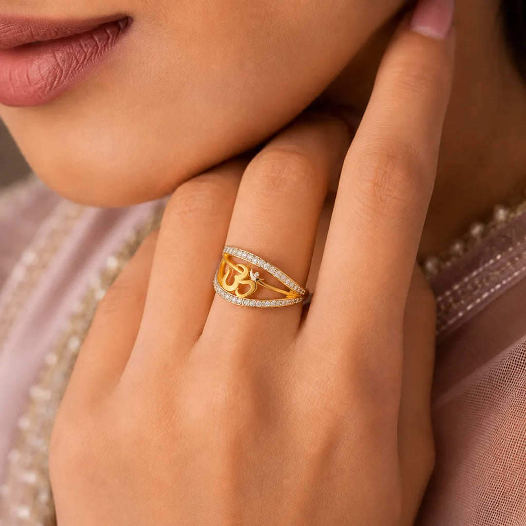 9K gold Om crystal ring for girls with white stone detailing and polished gold finish by Marvel Silver.