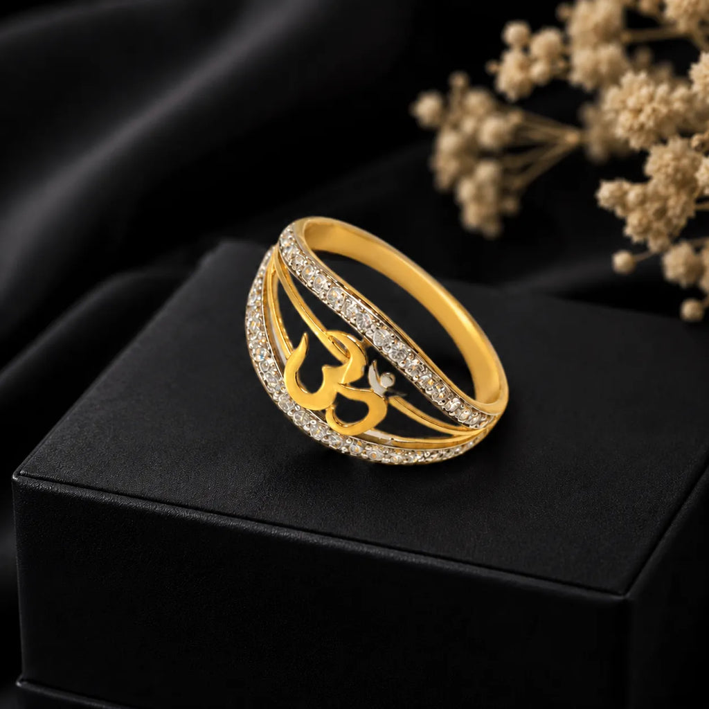 9K gold Om crystal ring for girls with white stone detailing and polished gold finish by Marvel Silver.