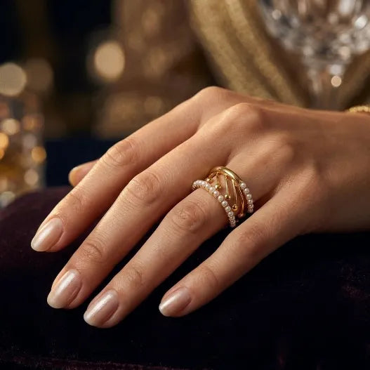 9K gold pearl designer ring for girls with openwork curved design and white pearl detailing by Marvel Silver.