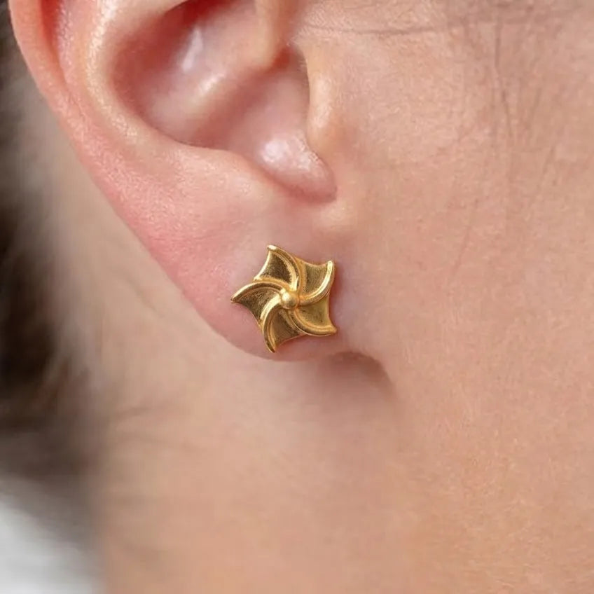 Marvel Silver 9K Gold pinwheel stud earrings for girls featuring a polished swirl-inspired geometric design with a premium gold finish.