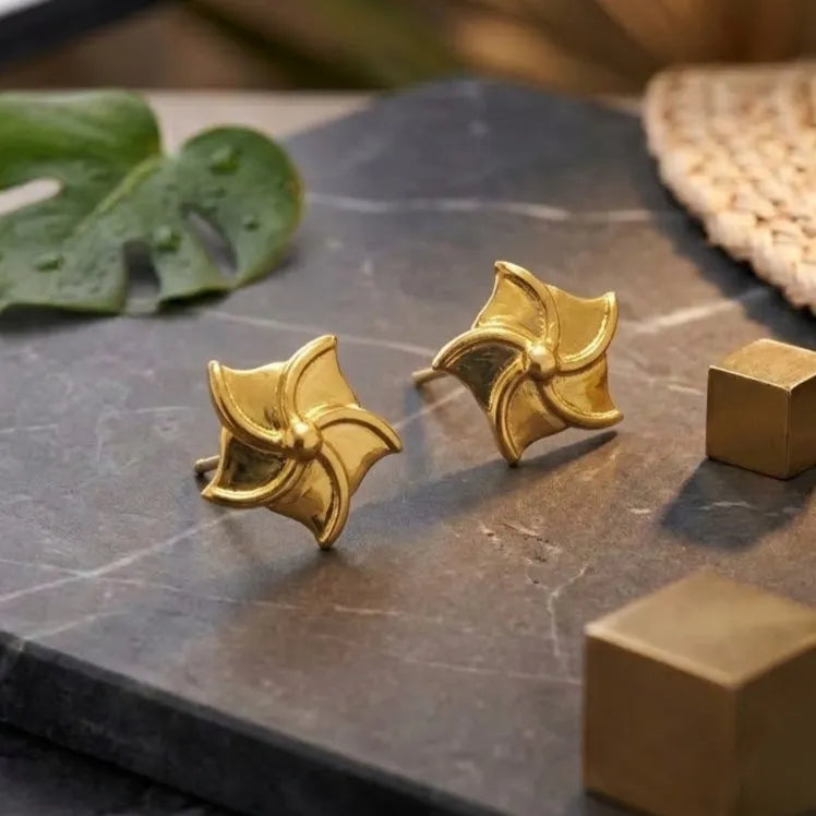 Marvel Silver 9K Gold pinwheel stud earrings for girls featuring a polished swirl-inspired geometric design with a premium gold finish.