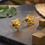 Marvel Silver 9K Gold pinwheel stud earrings for girls featuring a polished swirl-inspired geometric design with a premium gold finish.