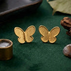 Marvel Silver 9K Gold textured butterfly stud earrings for girls with a minimalist designer butterfly shape and elegant gold finish.