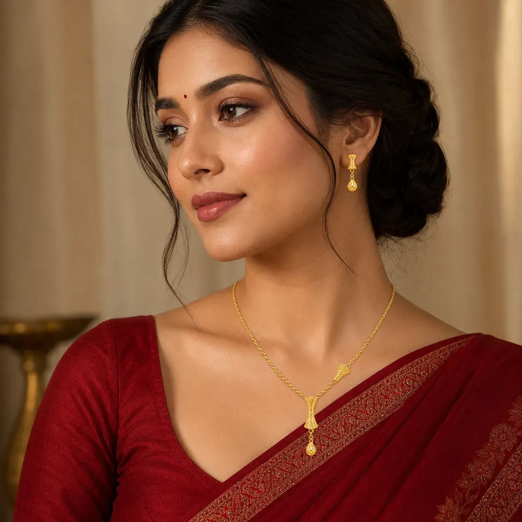 9K gold textured drop necklace set for women with an hourglass-style pendant and matching hanging earrings by Marvel Silver.