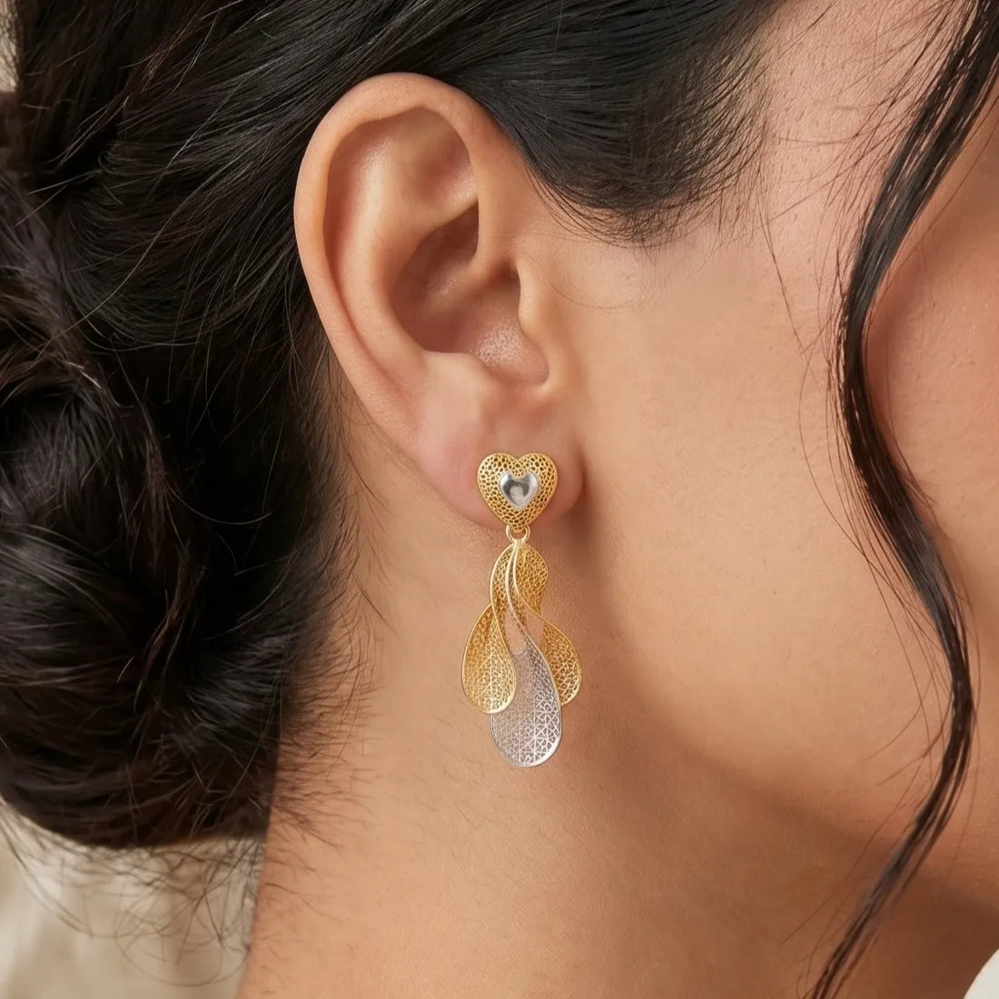 9K gold two tone heart leaf dangler earrings for girls with openwork lattice design and silver-tone heart detail by Marvel Silver.