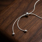 Marvel Silver adjustable silver bracelet for women with blue evil eye centerpiece and slider closure