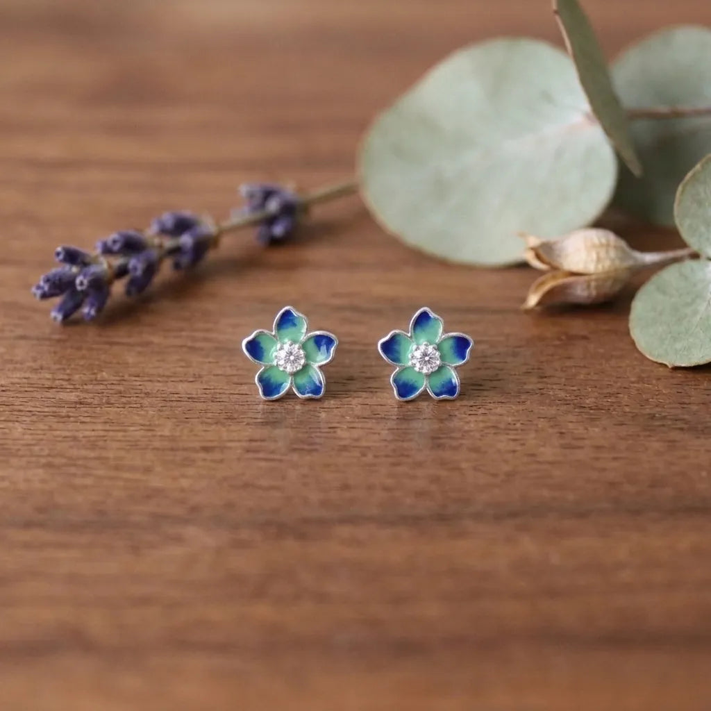 Marvel Silver amber floral crystal stud earrings featuring glossy enamel flower petals with a sparkling crystal centre for women and girls.