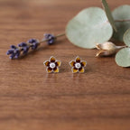 Marvel Silver amber floral crystal stud earrings featuring glossy enamel flower petals with a sparkling crystal centre for women and girls.