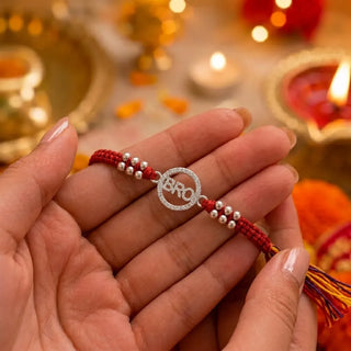 BRO Silver Rakhi with Red Thread & Silver Beads