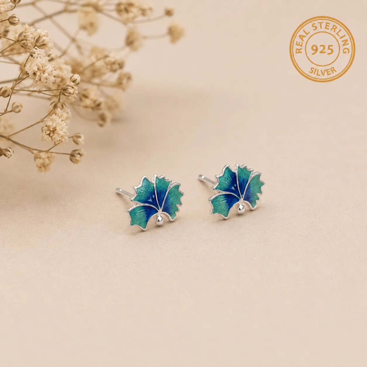 Marvel Silver blue and green enamel leaf stud earrings for women and girls featuring a silver-plated finish with a nature-inspired minimalist design.