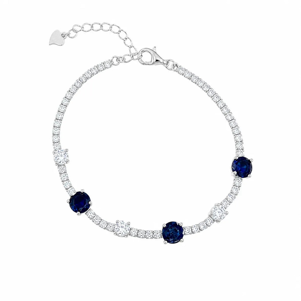 Marvel Silver 925 sterling silver tennis bracelet featuring sparkling blue sapphire-inspired Cubic Zirconia stones with brilliant white AAA Cubic Zirconia accents, rhodium-plated finish, adjustable extension chain, elegant bracelet for women and girls suitable for daily wear, parties, weddings, anniversaries, and gifting.