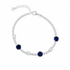 Marvel Silver 925 sterling silver tennis bracelet featuring sparkling blue sapphire-inspired Cubic Zirconia stones with brilliant white AAA Cubic Zirconia accents, rhodium-plated finish, adjustable extension chain, elegant bracelet for women and girls suitable for daily wear, parties, weddings, anniversaries, and gifting.
