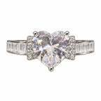 Marvel Silver Bow Accent Heart Crystal Silver Ring for Girls and Women Featuring a Large Sparkling Heart-Shaped Centre Stone, Crystal-Studded Bow Side Accents and Elegant Silver Band