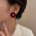Marvel Silver burgundy velvet flower imitation stud earrings with gold-tone floral center for women.