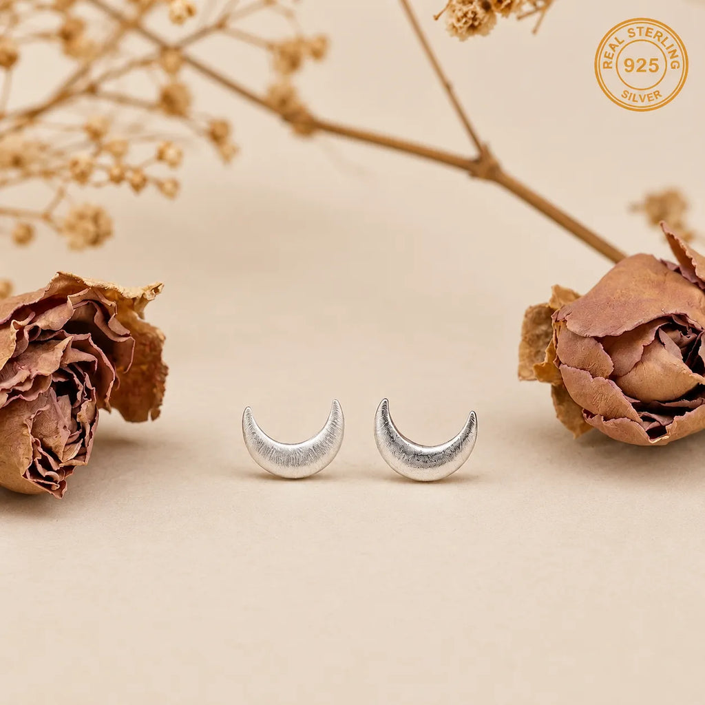 Marvel Silver crescent moon stud earrings for women and girls featuring a minimalist silver-plated celestial moon design with a polished finish and secure stud backing.