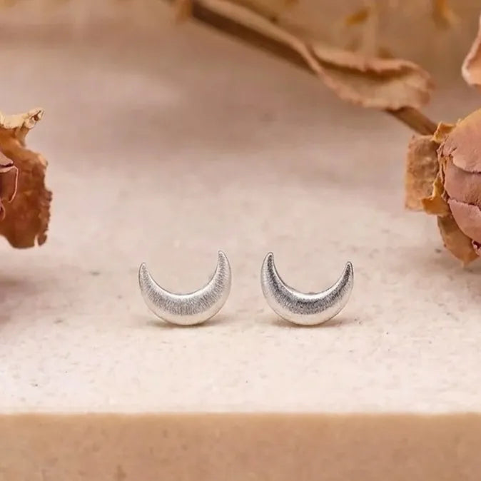 Marvel Silver crescent moon stud earrings for women and girls featuring a minimalist silver-plated celestial moon design with a polished finish and secure stud backing.