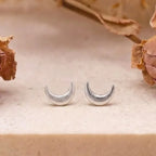 Marvel Silver crescent moon stud earrings for women and girls featuring a minimalist silver-plated celestial moon design with a polished finish and secure stud backing.